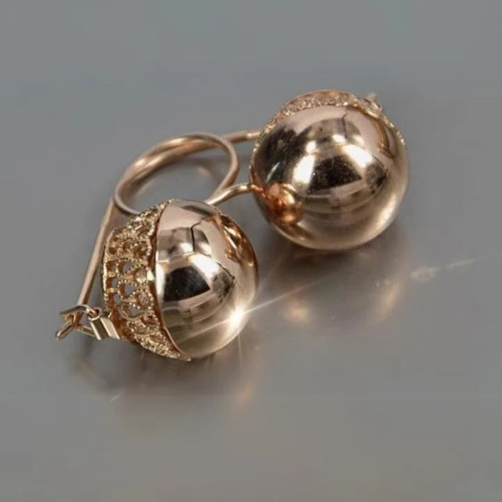 Abgerundete goldene Glasohrringe